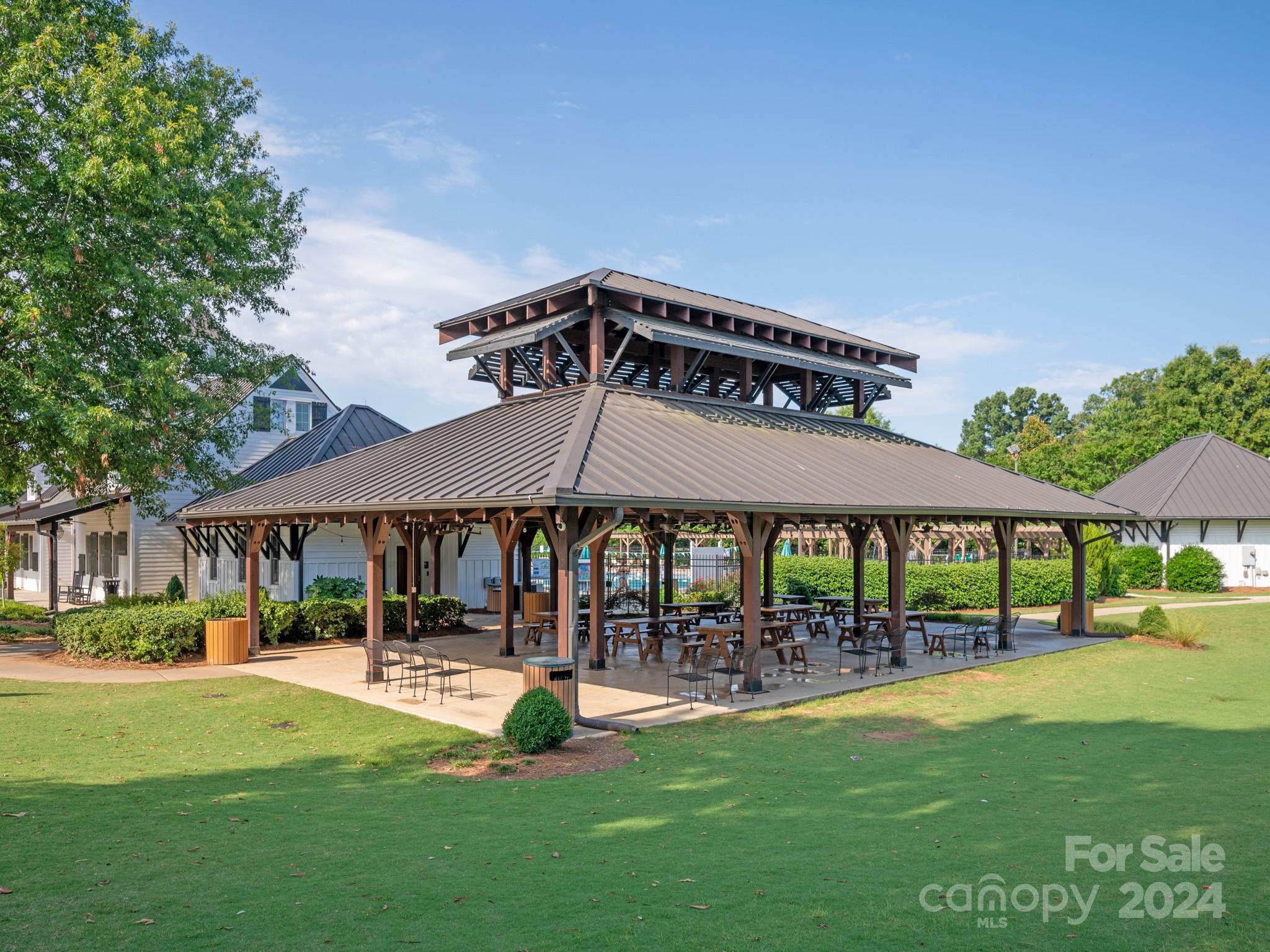 238 Horton Grove Road Fort Mill, SC 29715 - Photo 44 of 47 a patio table and chairs with the garden in the background