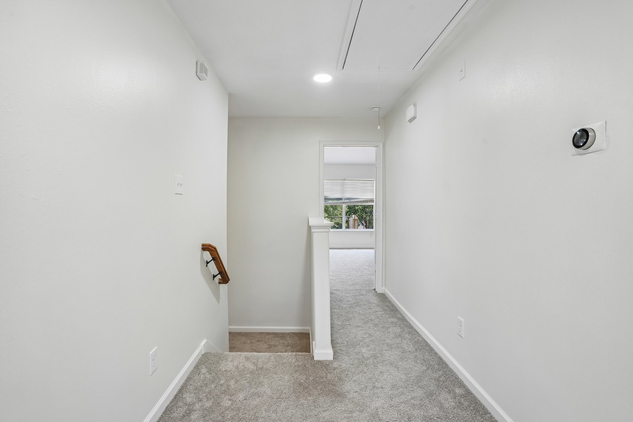 4419 Crossvine Avenue Baytown, TX 77521 - Photo 14 of 38 Hallway and view of the entrance to the primary bedroom.