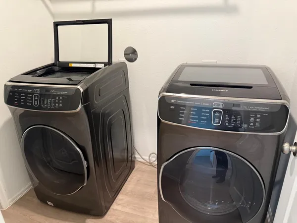 a utility room with dryer and washer
