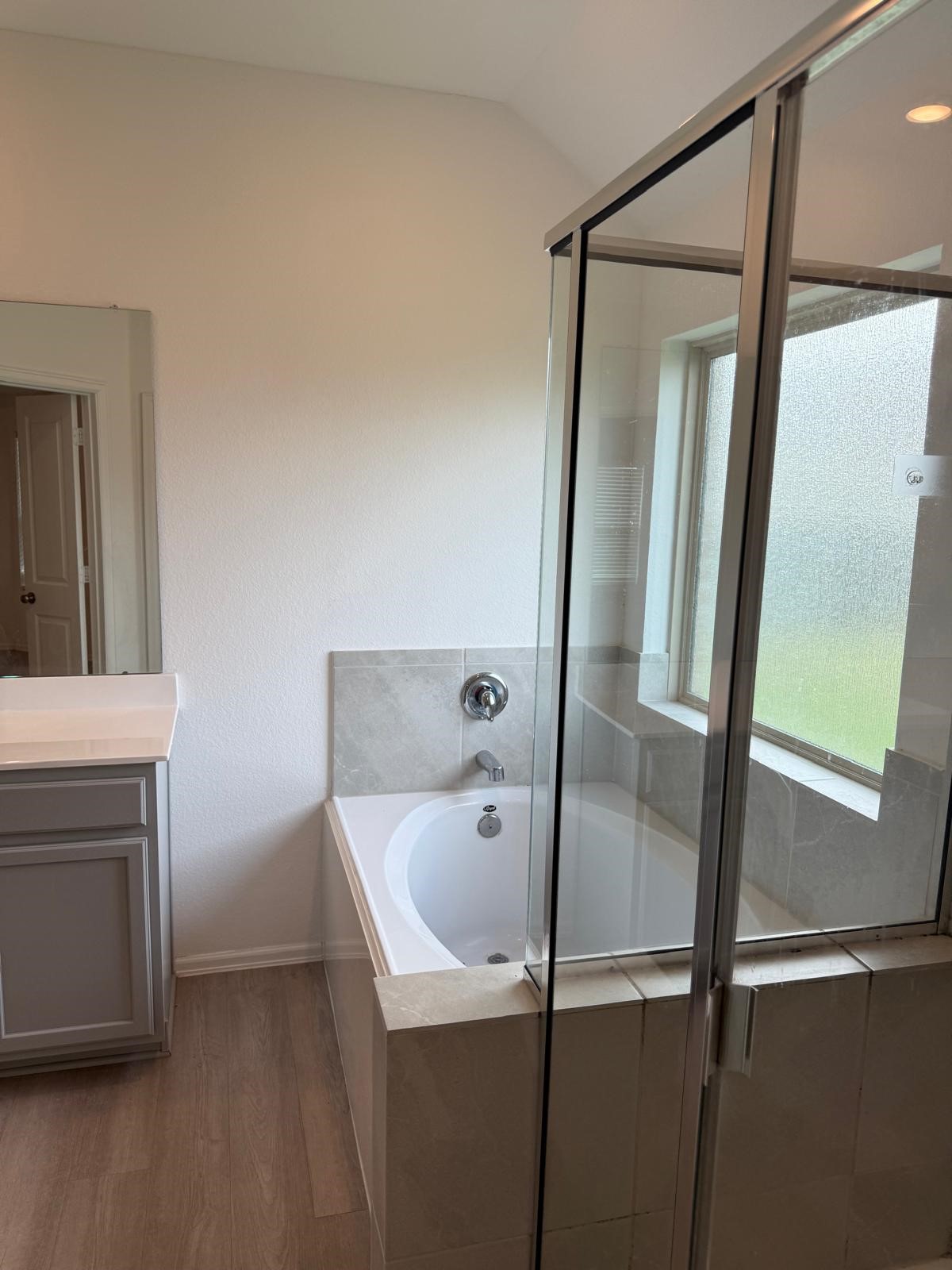 5335 Winding Strm Drive Rosenberg, TX 77469 - Photo 18 of 26 a bathroom with a bathtub and a shower