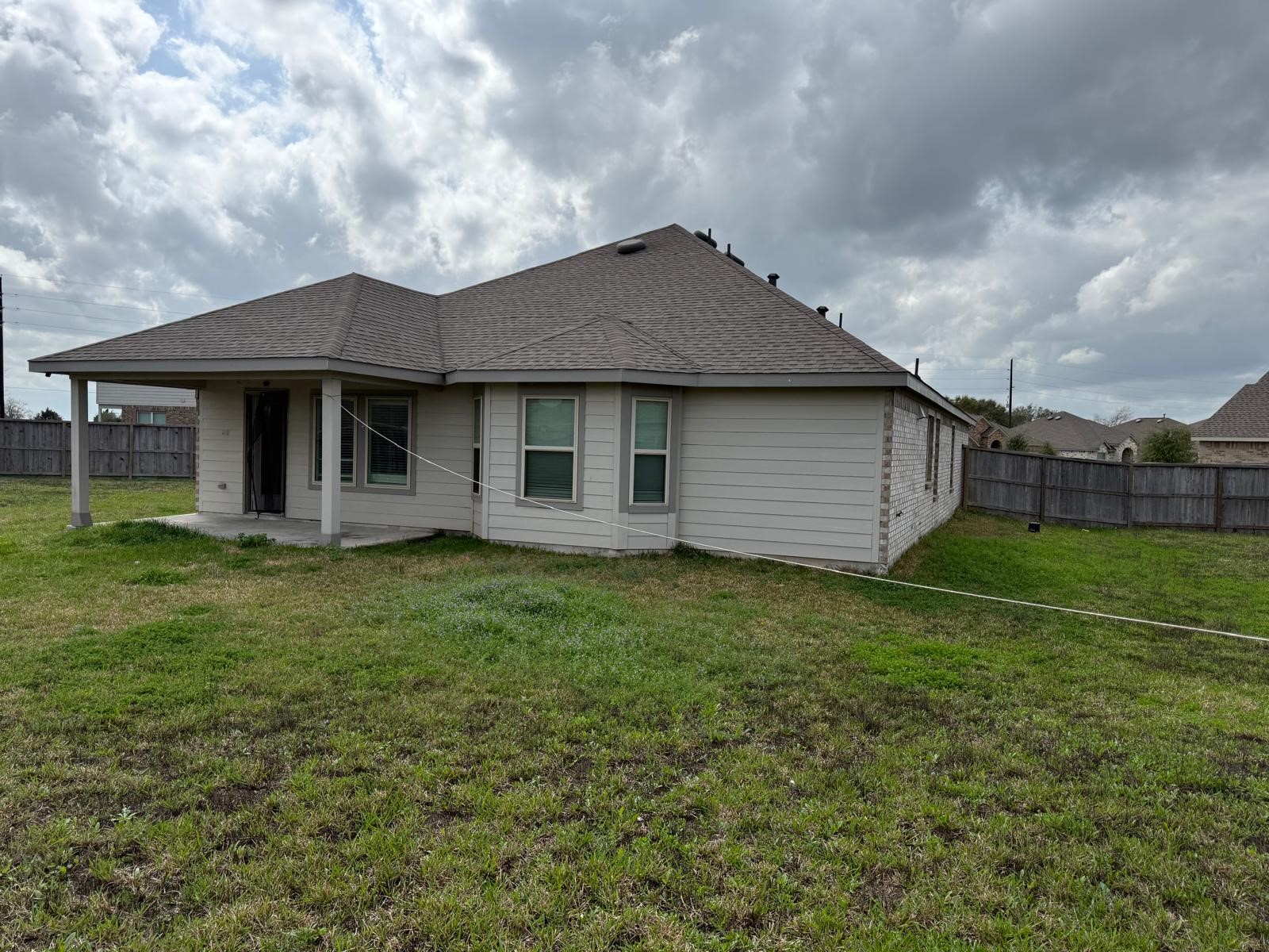 5335 Winding Strm Drive Rosenberg, TX 77469 - Photo 19 of 26 a backyard of a house with lots of green space