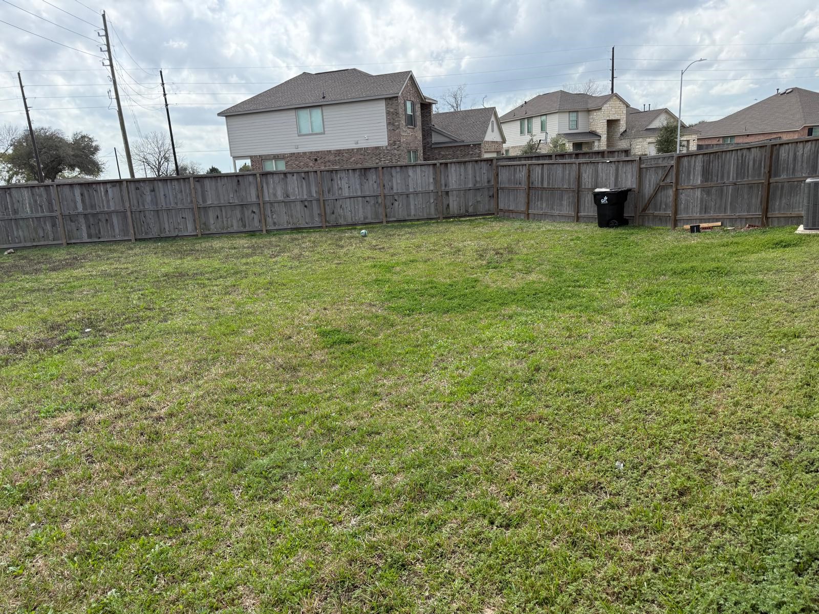 5335 Winding Strm Drive Rosenberg, TX 77469 - Photo 26 of 26 a view of a house with a yard and wooden fence