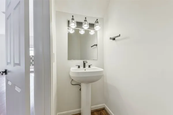 a bathroom with a sink a mirror and a shower