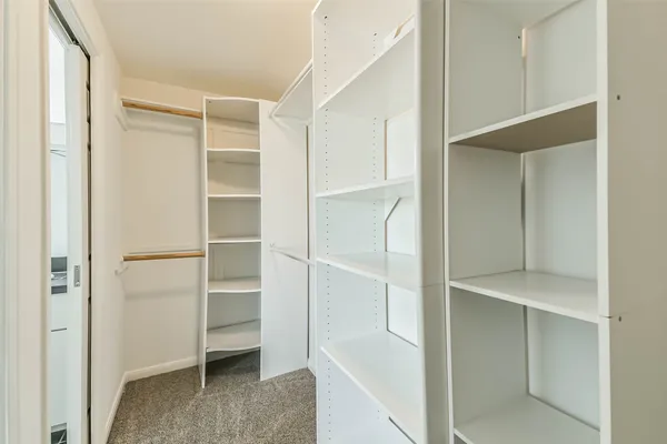 a view of an empty walk in closet