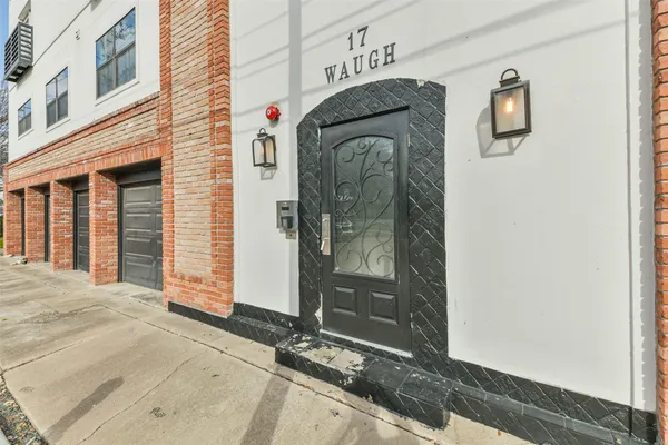 a front view of a house with parking area