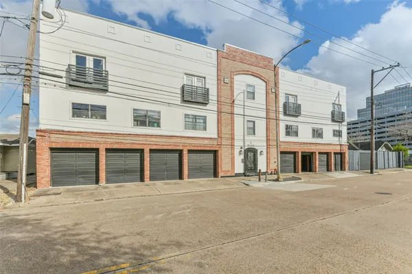a front view of a building with a street