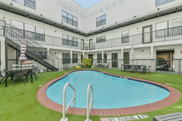a view of a swimming pool with a lounge chairs