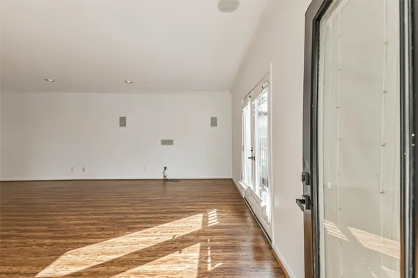 a view of a room with an empty space and a sink
