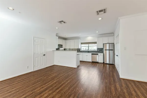 a view of kitchen with wooden floor