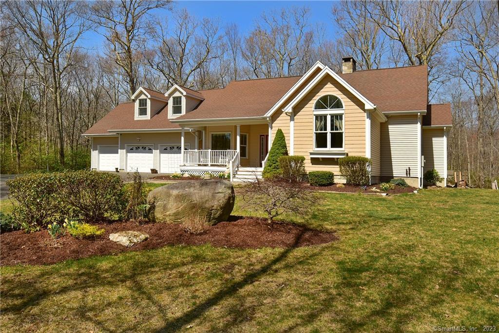 143 Plains Road Tolland, CT 06084 - Photo 1 of 1 a front view of a house with a yard