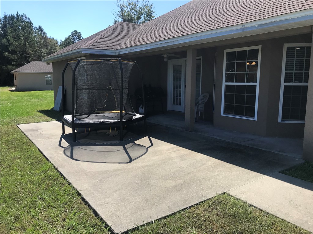 128 Avondale Road Brunswick, GA 31523 - Photo 3 of 12 COVERED BACK PORCH & PATIO
