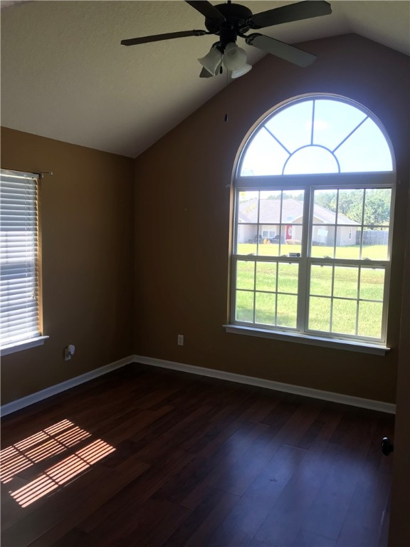 128 Avondale Road Brunswick, GA 31523 - Photo 9 of 12 BEDROOM 1 - VAULTED CEILINGS | VINYL WOOD FLOORING | LARGE WINDOWS |FACING FRONT VIEWS