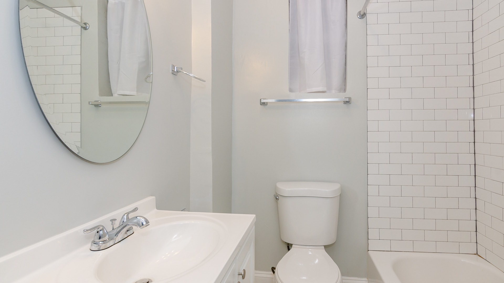 2049 West Coulter Street, Unit 1R Chicago, IL 60608 - Photo 10 of 10 a white toilet sitting next to a bathroom sink