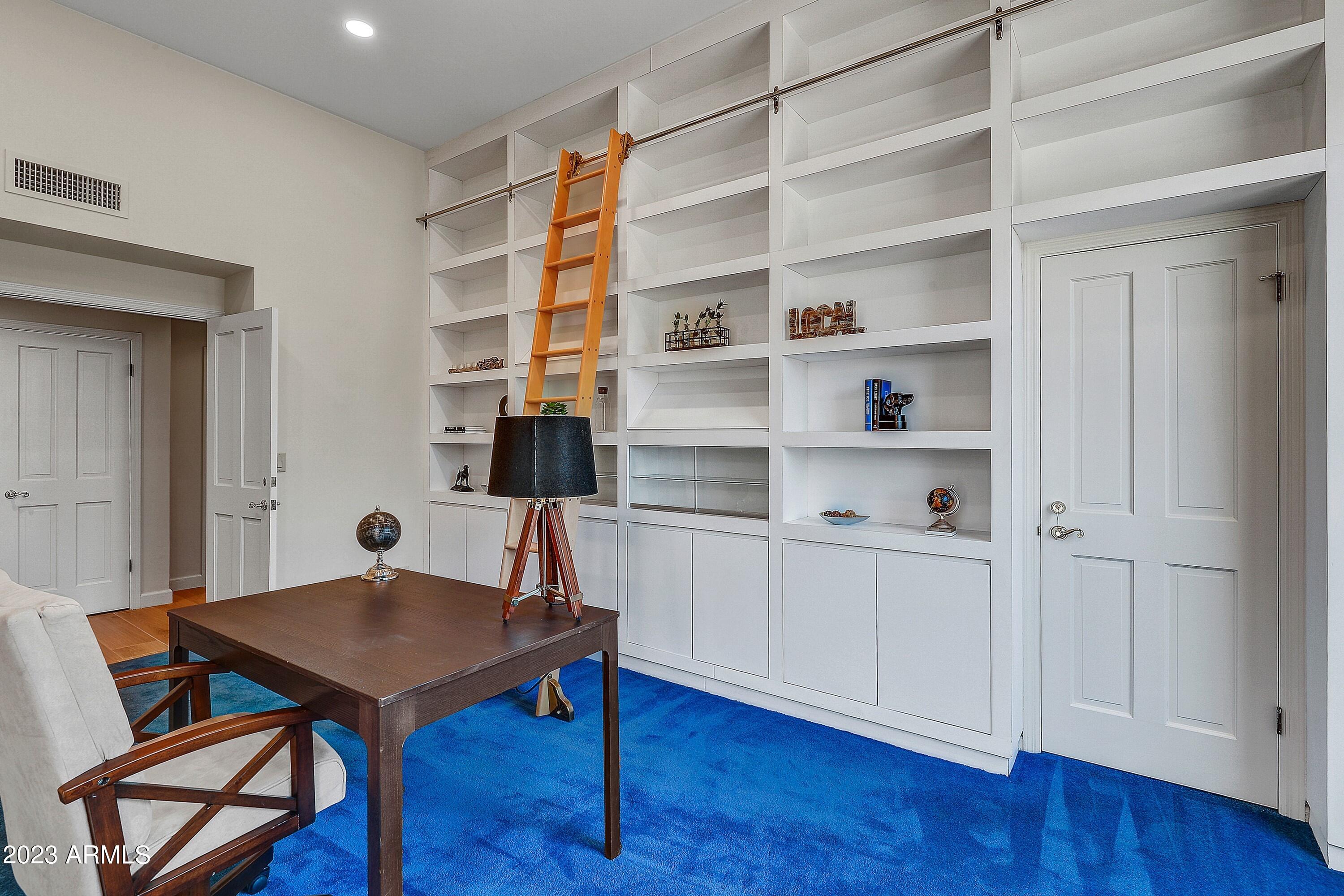4436 East Camelback Road, Unit 36 Phoenix, AZ 85018 - Photo 9 of 34 010_Bookcase, cabinets, closet