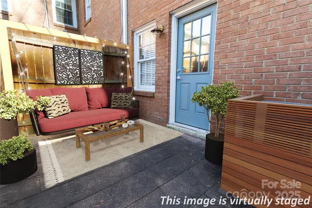 a view of room with stairs and wooden floor