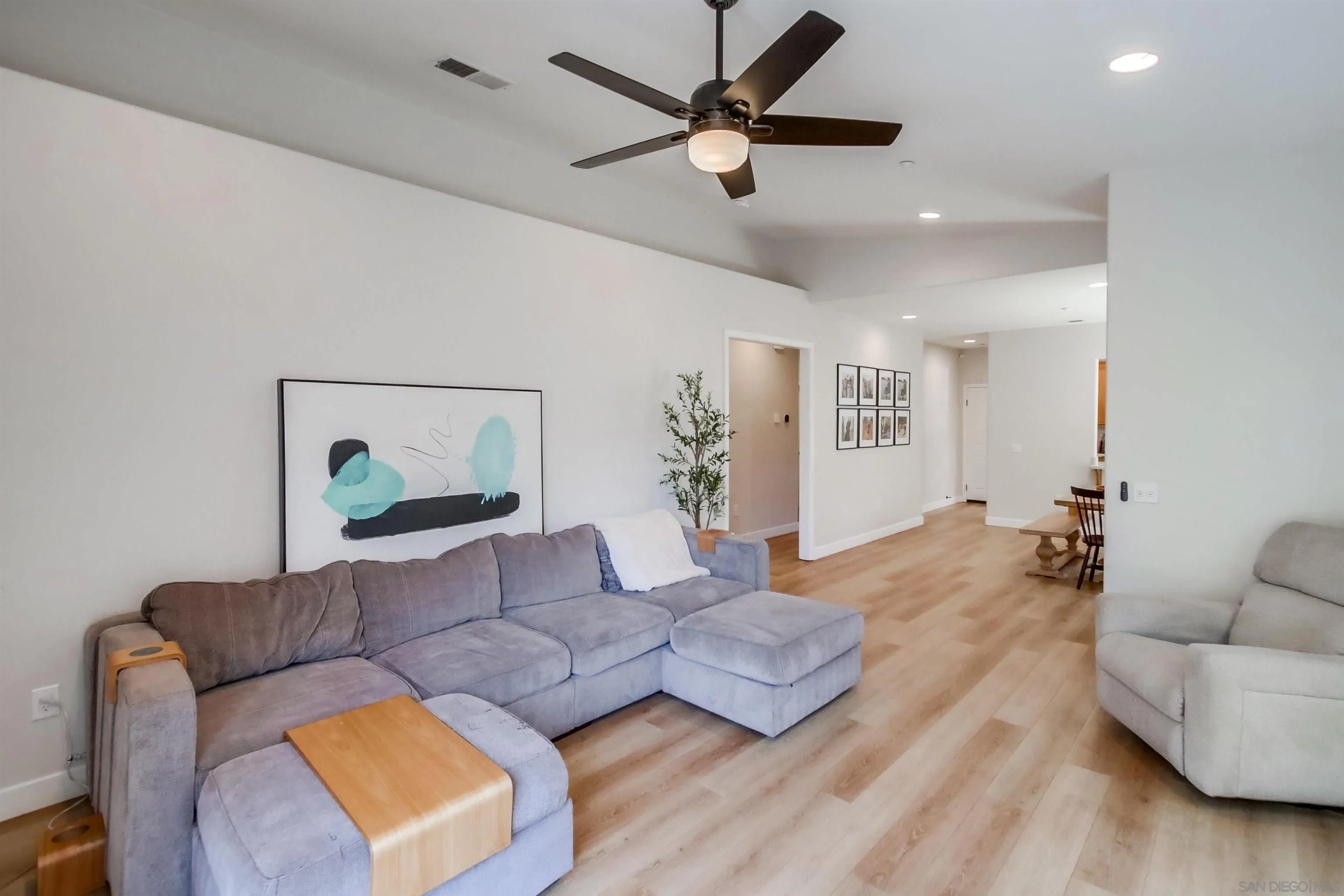 8535 Elliot Lane Santee, CA 92071 - Photo 14 of 43 a living room with furniture and a wooden floor