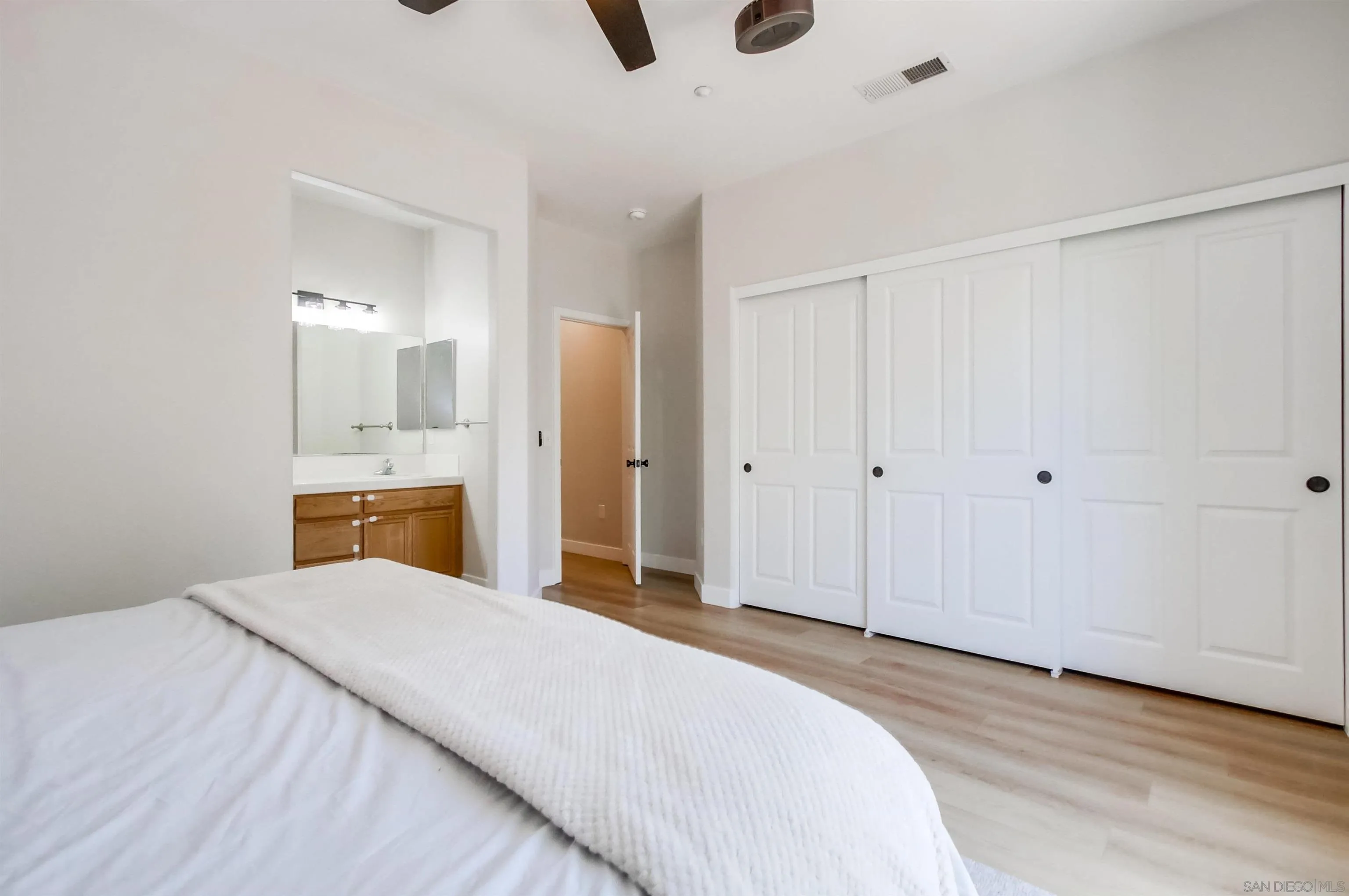 8535 Elliot Lane Santee, CA 92071 - Photo 21 of 43 a bedroom with a bed and a view of bathroom