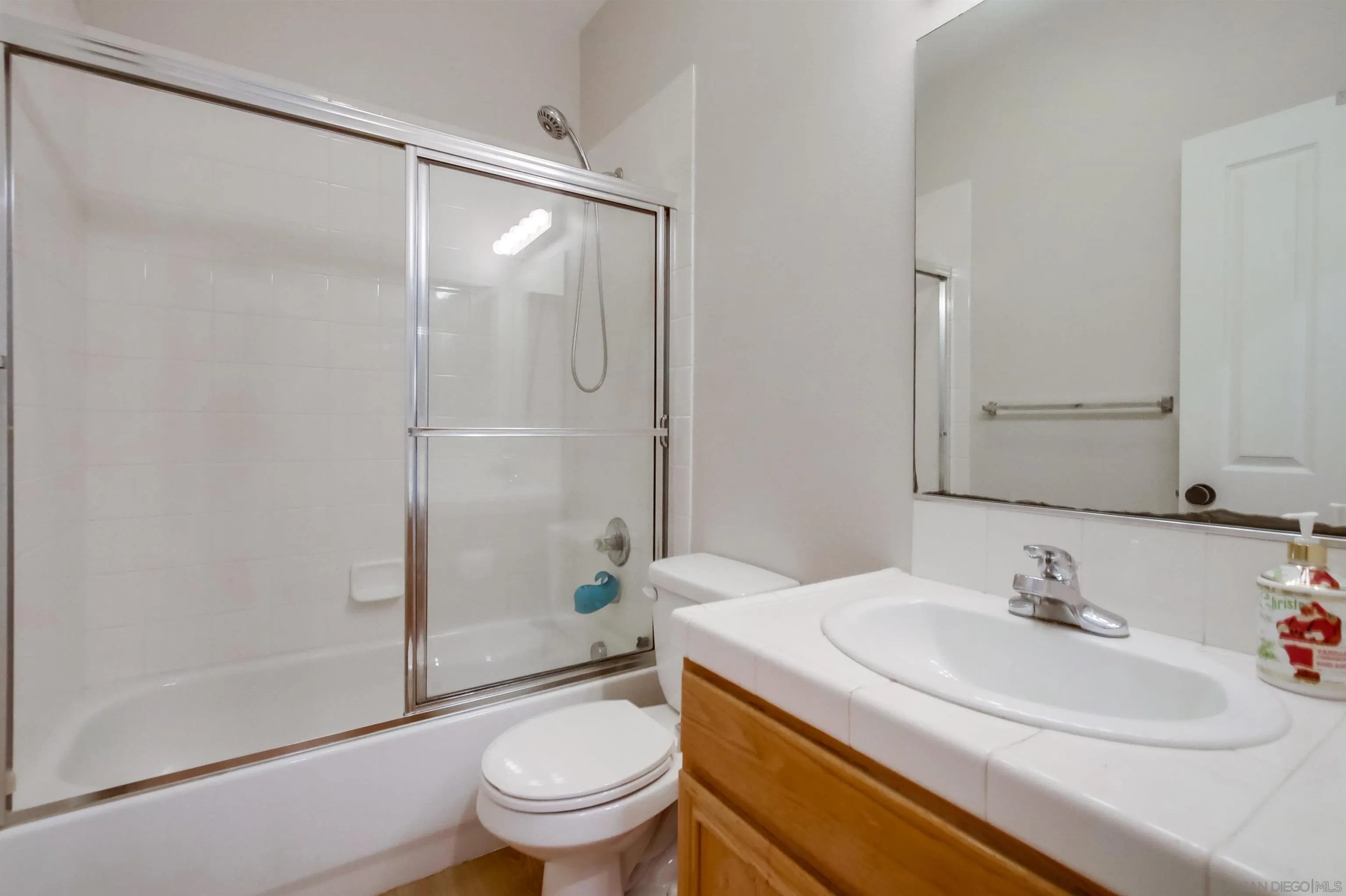 8535 Elliot Lane Santee, CA 92071 - Photo 29 of 43 a bathroom with a sink toilet and shower