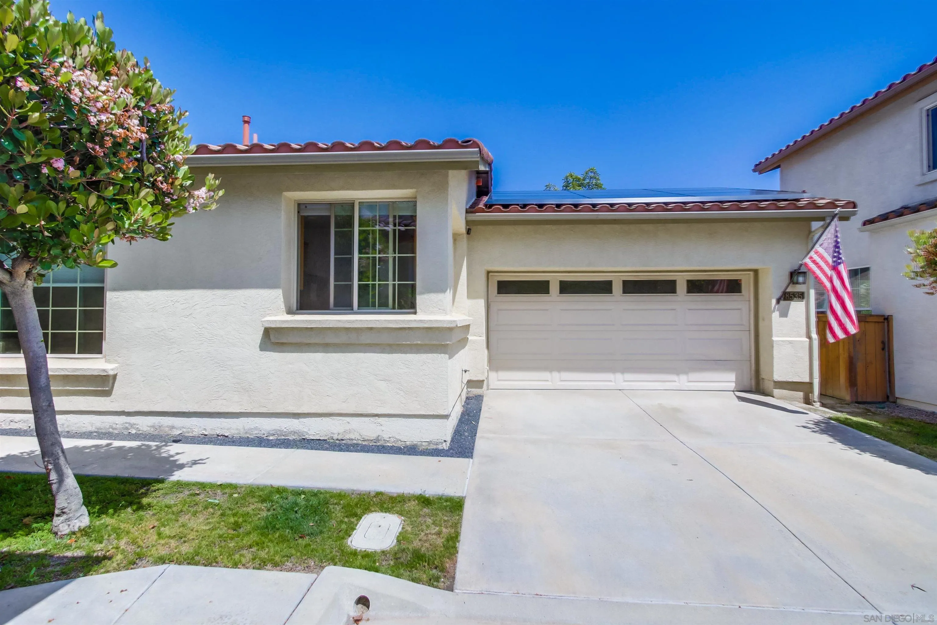 8535 Elliot Lane Santee, CA 92071 - Photo 10 of 43 a view of a house with a small yard and a large tree
