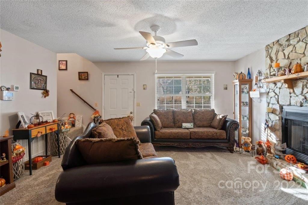 143 Mathis Dairy Road Spartanburg, SC 29307 - Photo 4 of 16 a living room with furniture and a fireplace