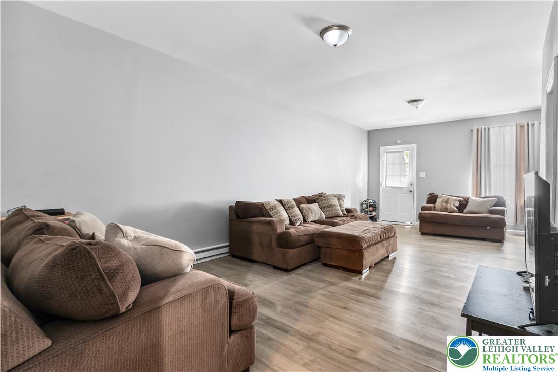 12 South Front Street Coplay, PA 18037 - Photo 21 of 41 This versatile living area offers ample space and durable flooring for everyday comfort.