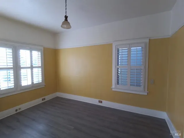 a view of a yard with a tree