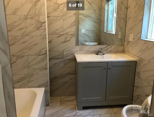 a view of a room with wooden floor and a window