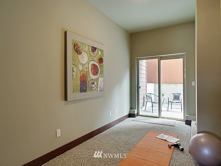3910 Northeast 3rd Place Renton, WA 98056 - Photo 13 of 15 a view of an empty room with window and furniture