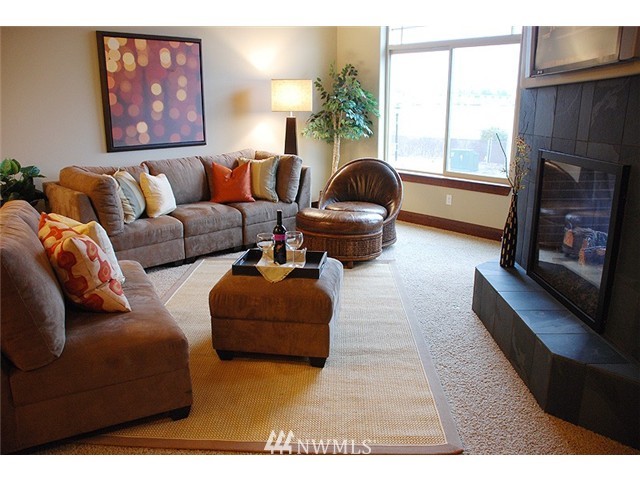 3910 Northeast 3rd Place Renton, WA 98056 - Photo 4 of 15 a living room with furniture and a fireplace