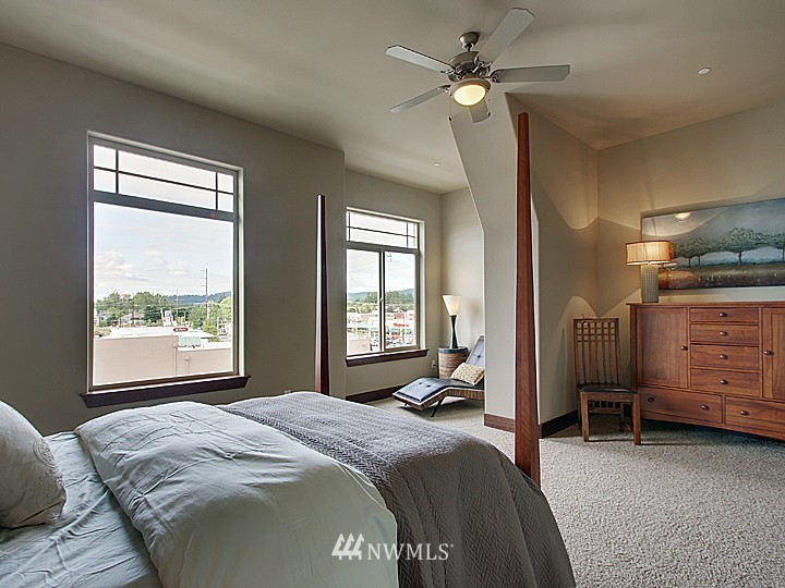 3910 Northeast 3rd Place Renton, WA 98056 - Photo 6 of 15 a bed room with a bed and a chair