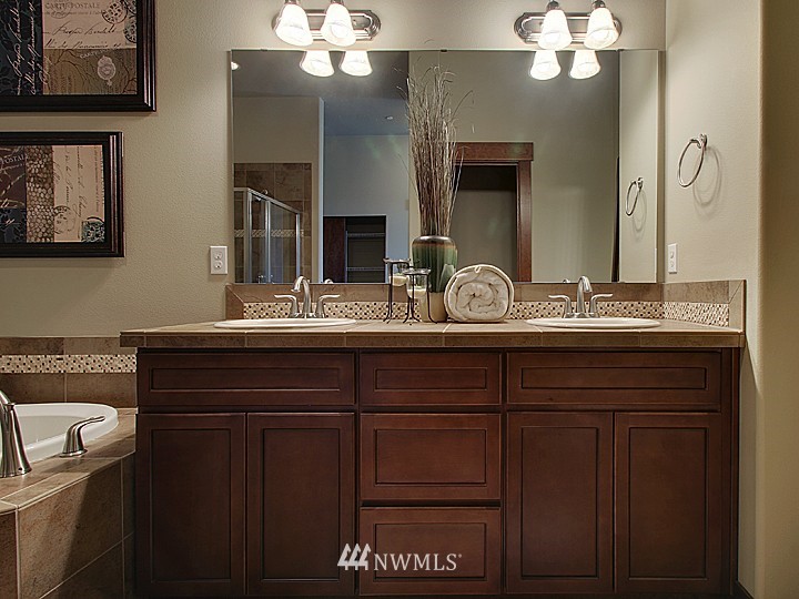 3910 Northeast 3rd Place Renton, WA 98056 - Photo 7 of 15 a bathroom with a granite countertop sink and a mirror