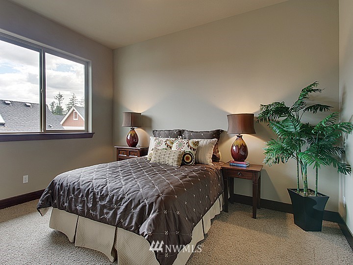 3910 Northeast 3rd Place Renton, WA 98056 - Photo 10 of 15 a bedroom with a bed and window