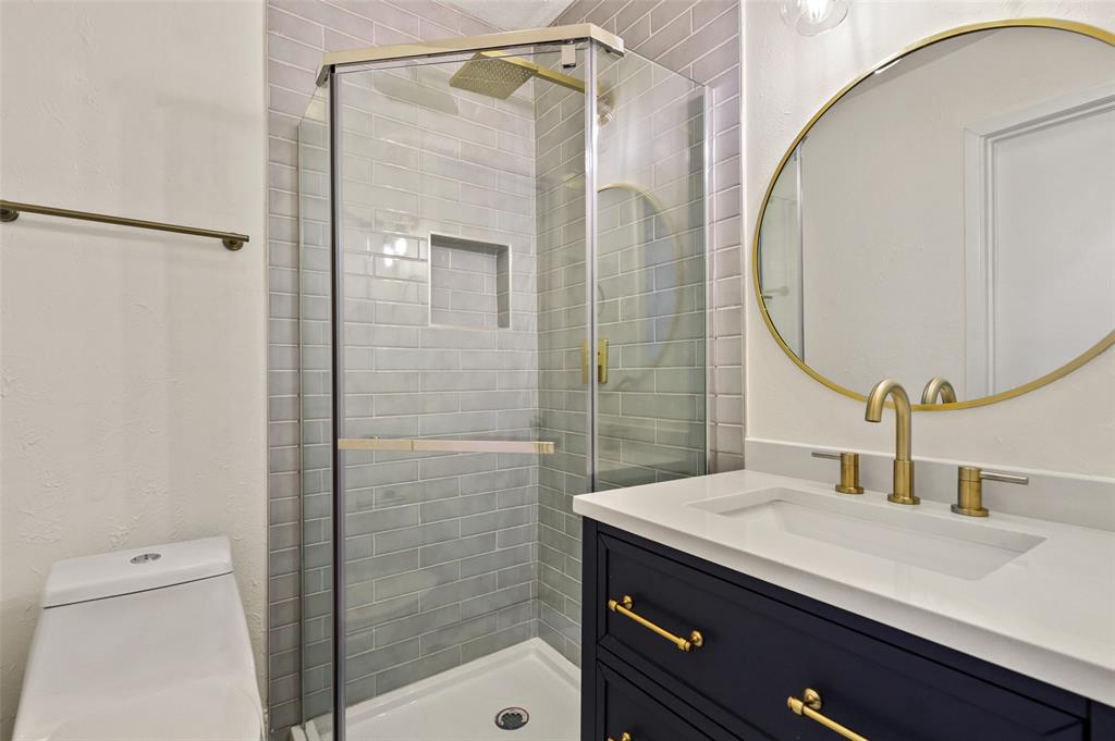 3126 Jubilee Trail Dallas, TX 75229 - Photo 14 of 38 a bathroom with a sink and a mirror