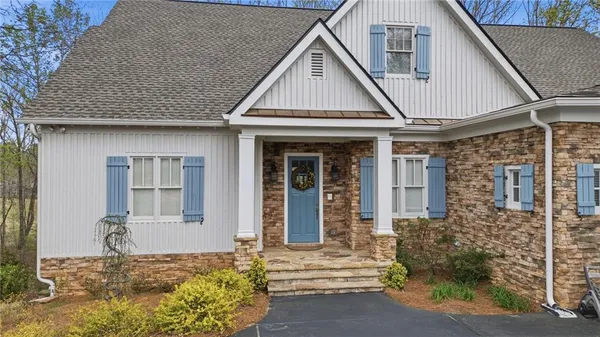 a view of a hallway view with wooden floor and staircase