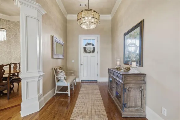 a living room with furniture and a lamp