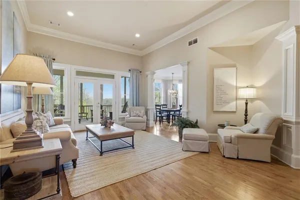 a view of a dining room with furniture window and wooden floor