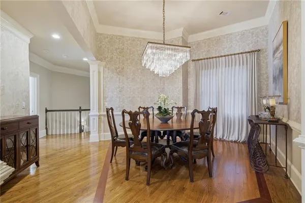 a living room with furniture a flat screen tv and a large window