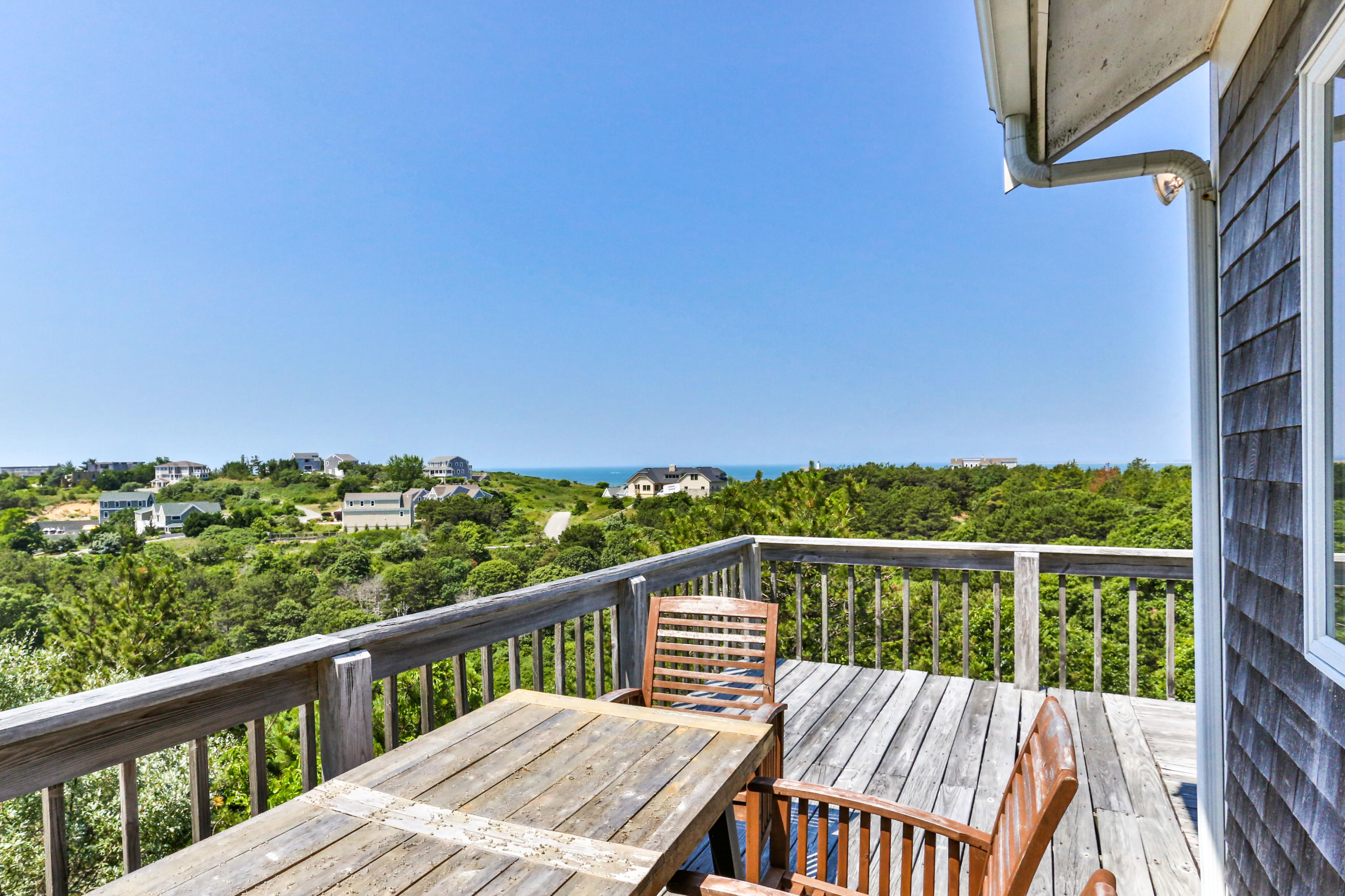 5 High Ridge Road Truro, MA 02666 - Photo 1 of 45 a view of a balcony with wooden floor and fence