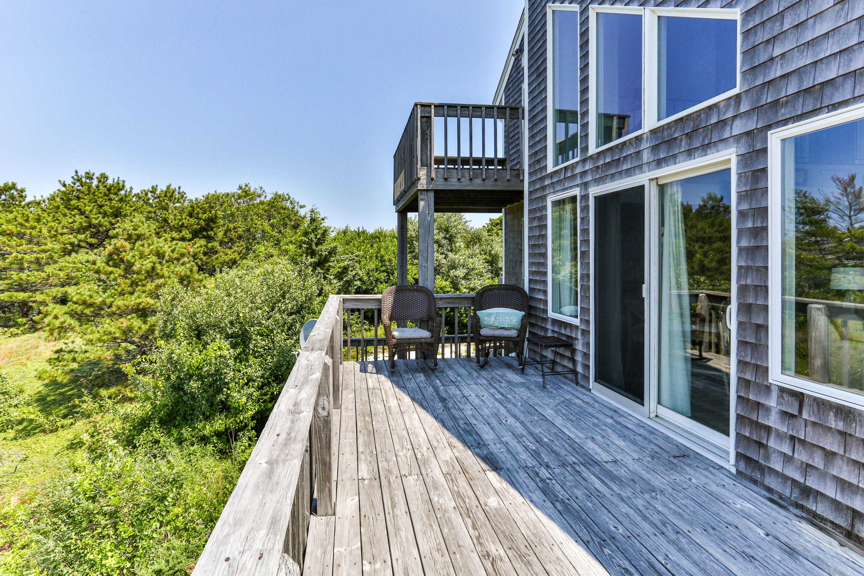 5 High Ridge Road Truro, MA 02666 - Photo 13 of 45 a view of a patio with table and chairs and wooden floor
