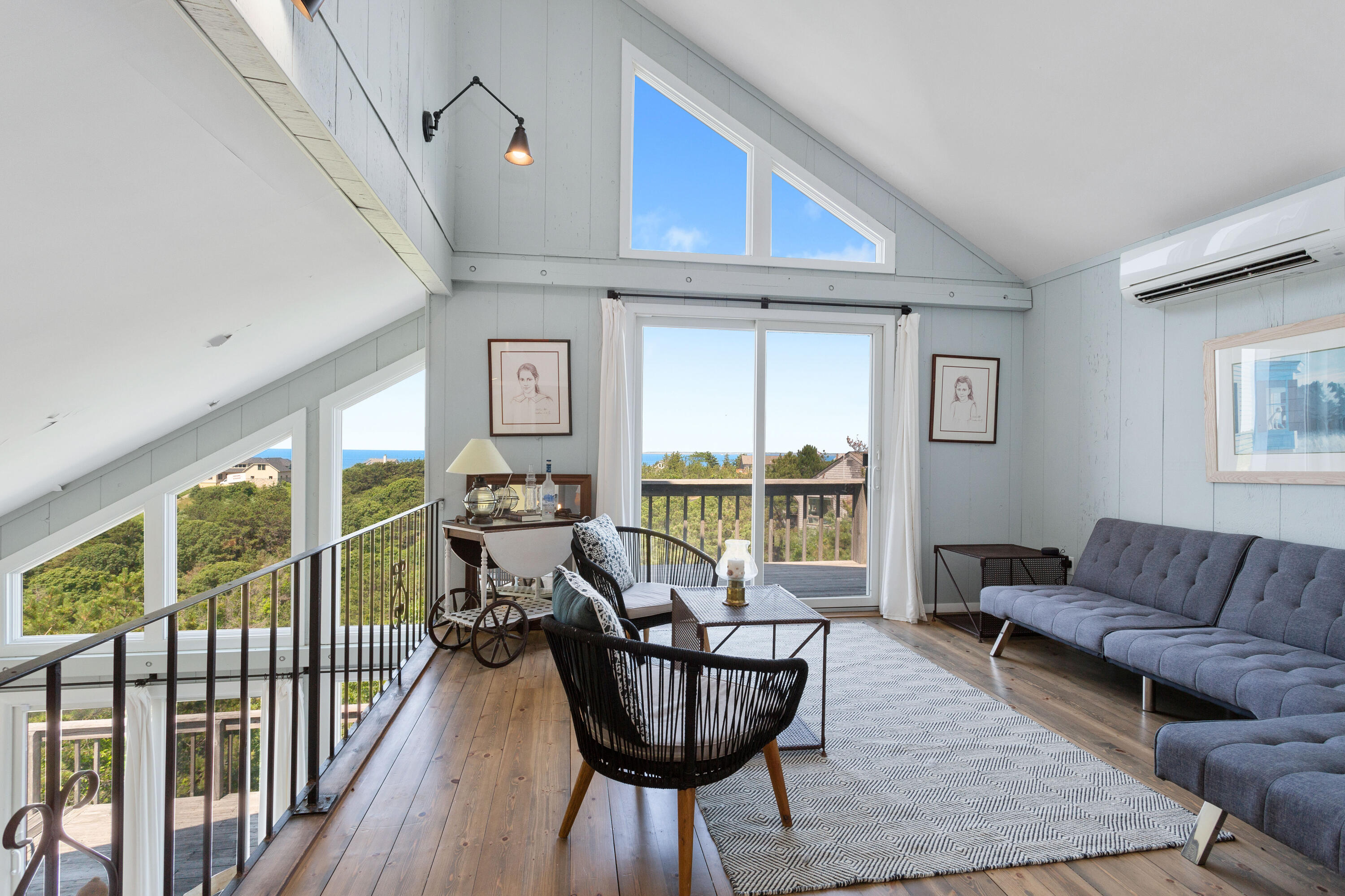 5 High Ridge Road Truro, MA 02666 - Photo 19 of 45 a living room with furniture and a large window