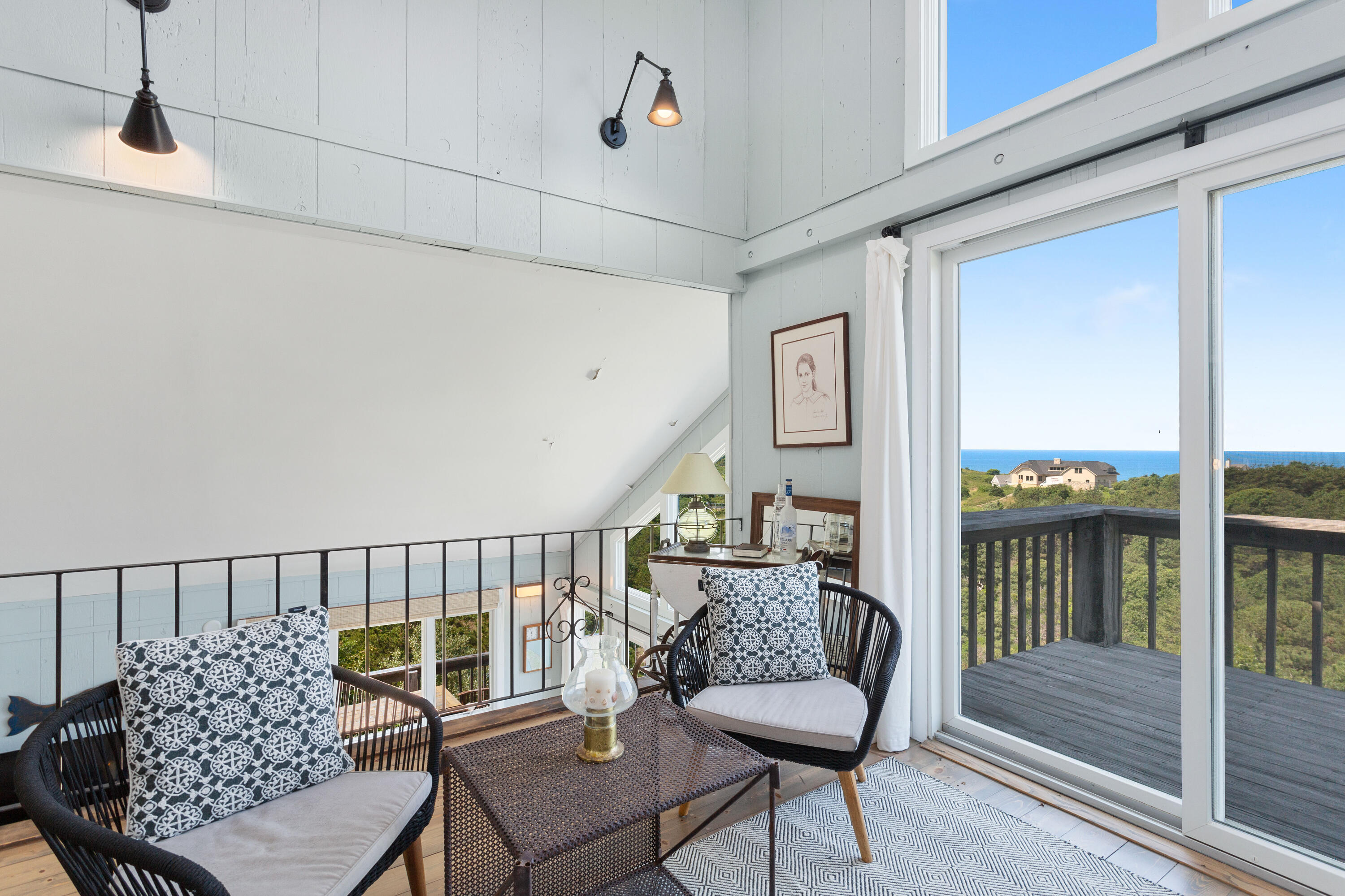 5 High Ridge Road Truro, MA 02666 - Photo 23 of 45 a balcony with furniture and wooden floor