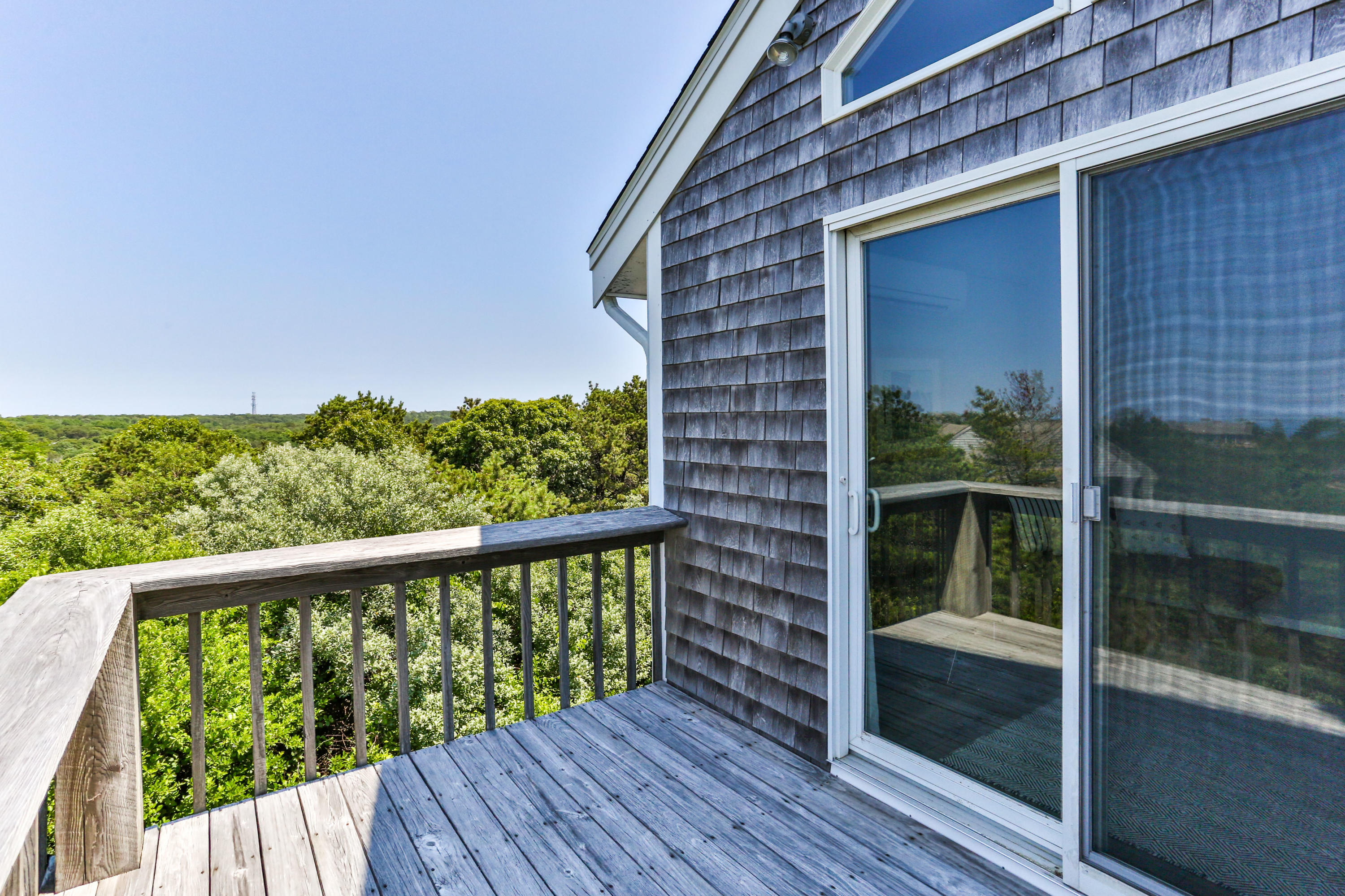 5 High Ridge Road Truro, MA 02666 - Photo 26 of 45 a view of a brick house with a large window