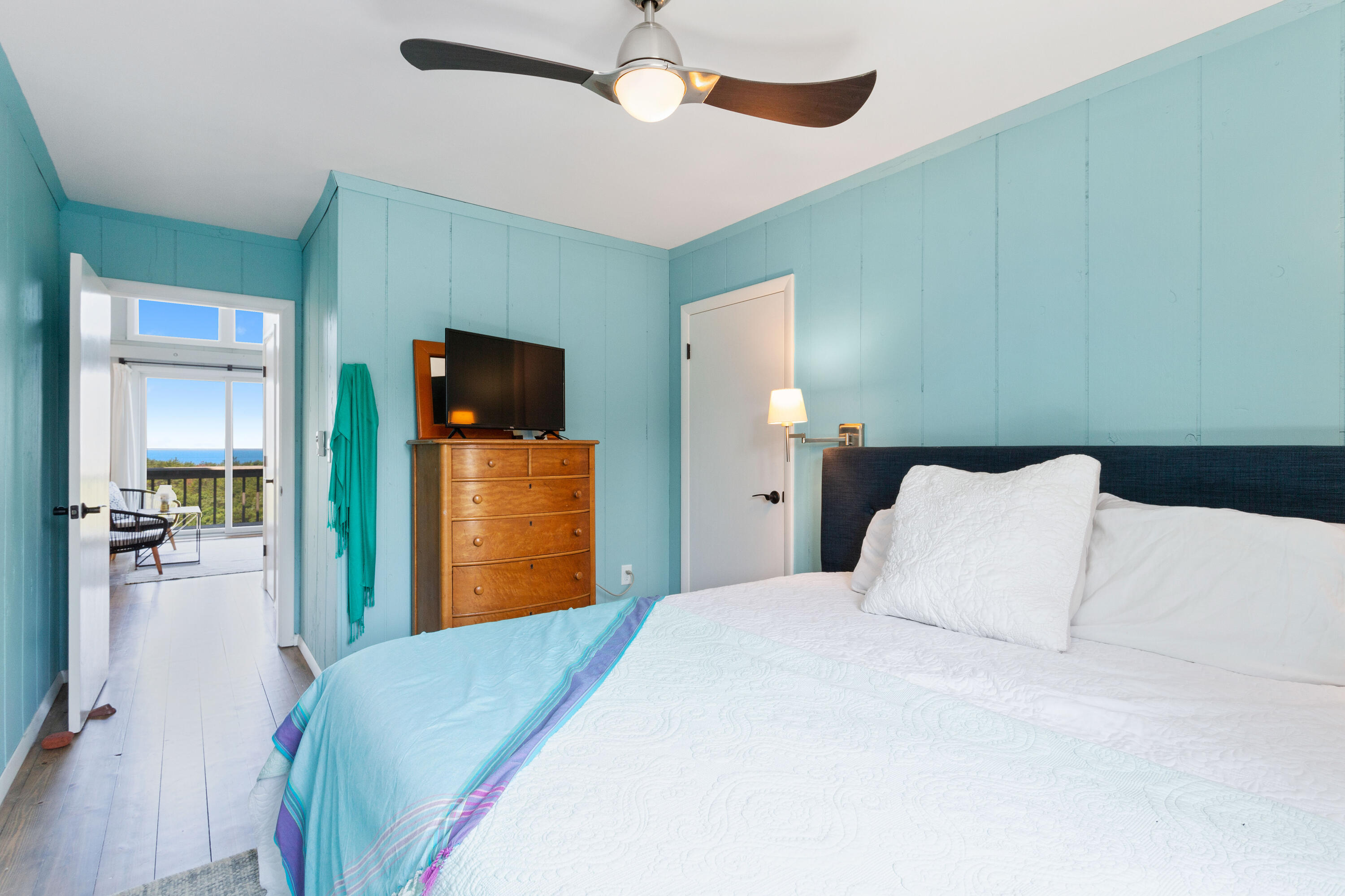 5 High Ridge Road Truro, MA 02666 - Photo 29 of 45 a bedroom with a bed and a large mirror on dresser