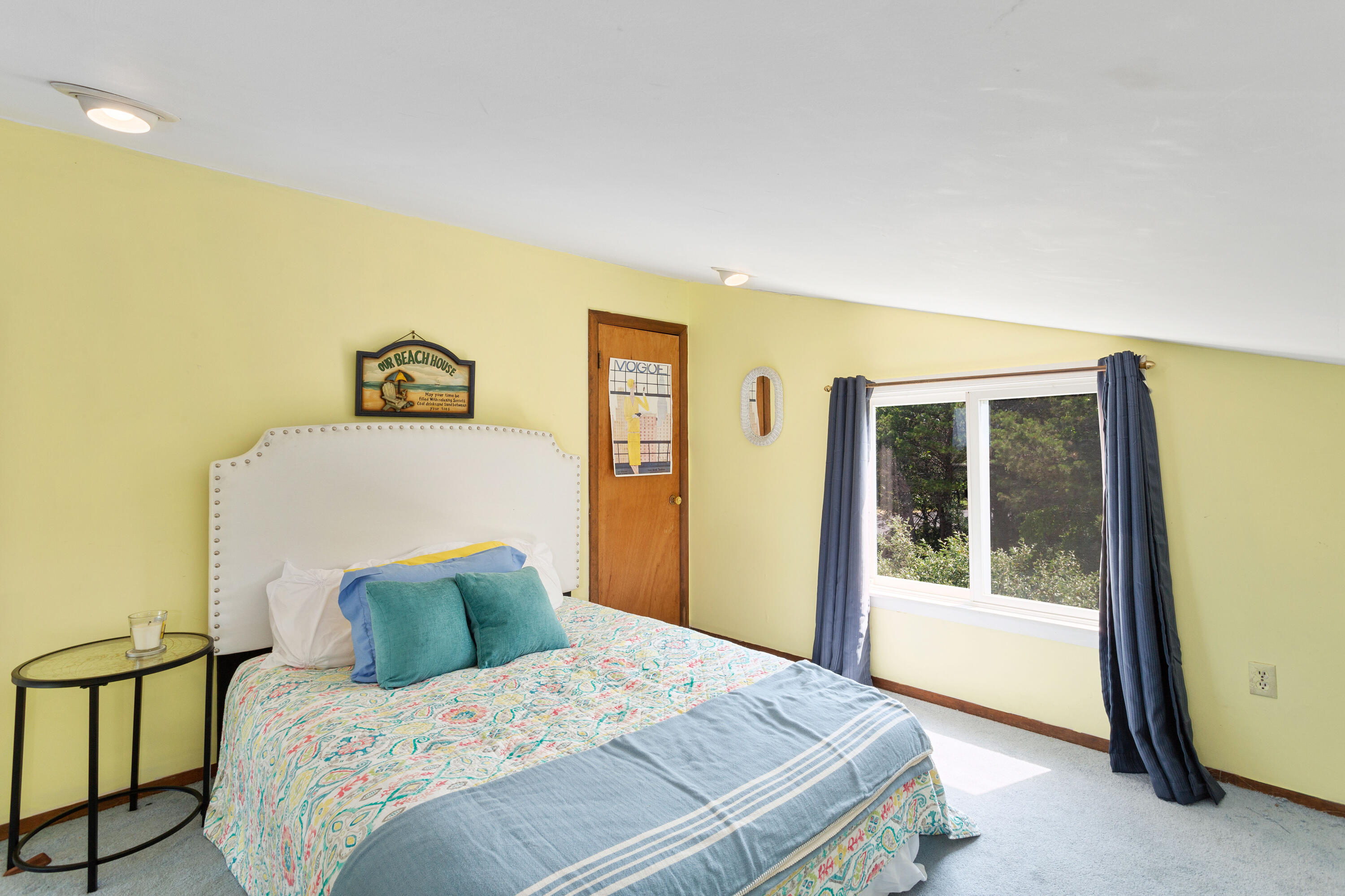 5 High Ridge Road Truro, MA 02666 - Photo 30 of 45 a bedroom with a bed and glass door