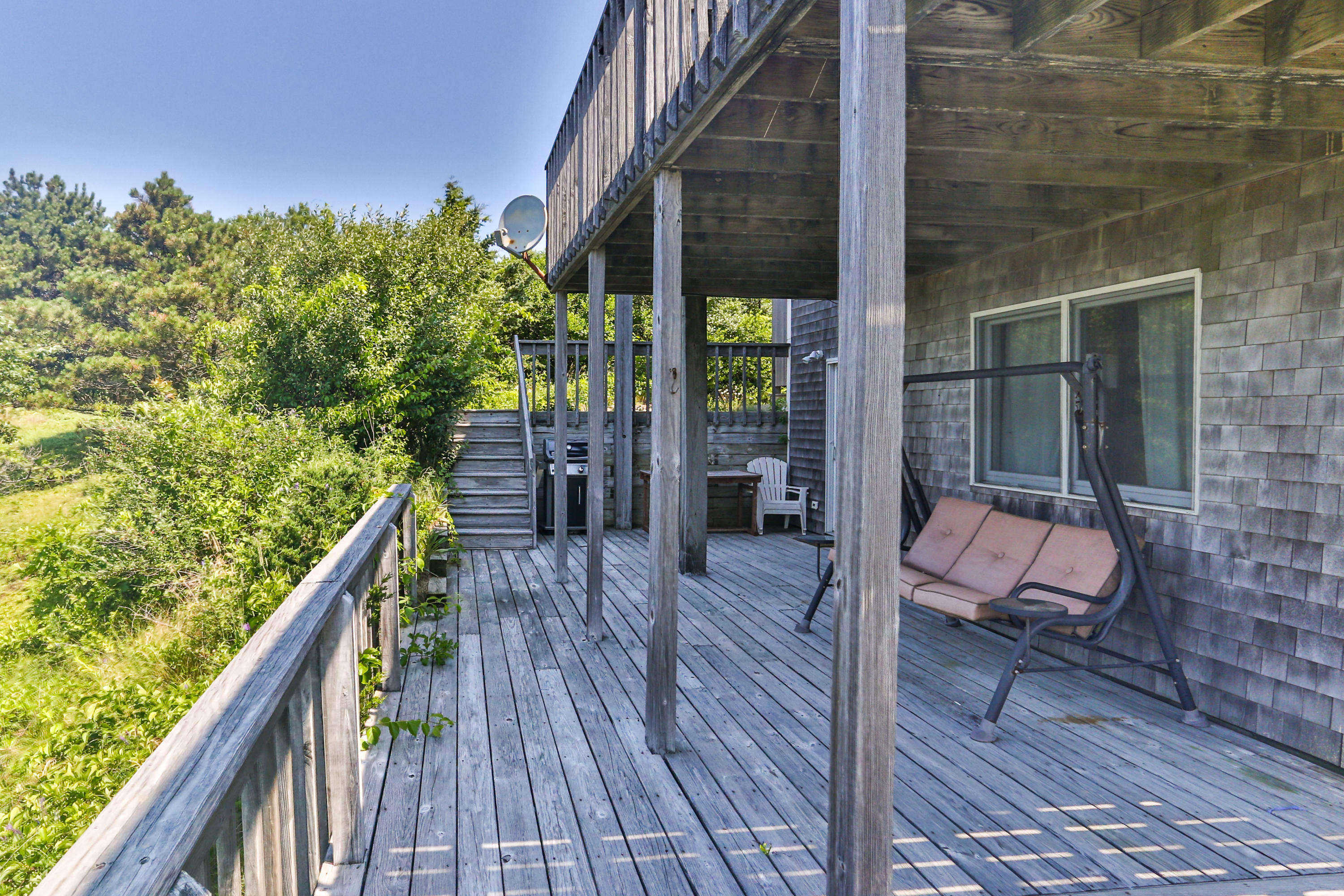 5 High Ridge Road Truro, MA 02666 - Photo 39 of 45 a balcony with wooden floor and outdoor seating