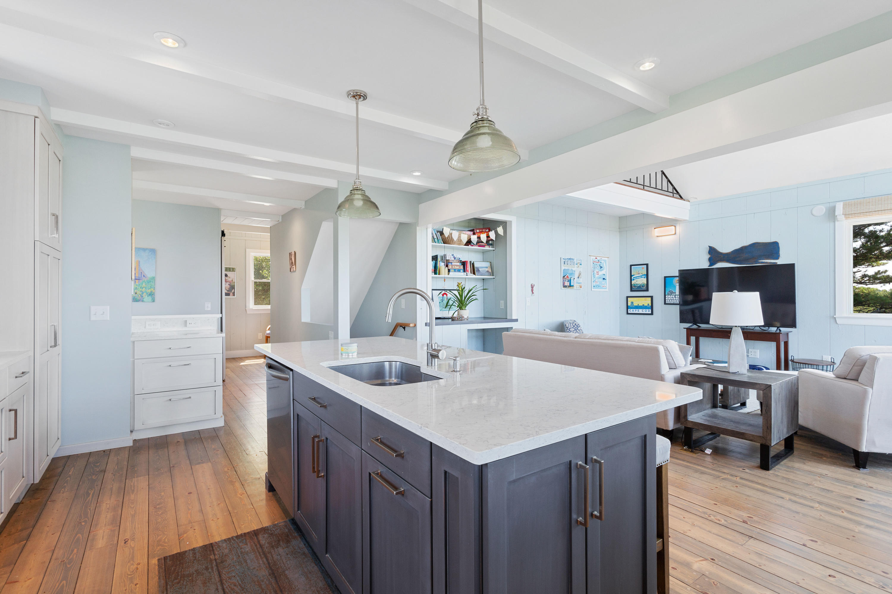 5 High Ridge Road Truro, MA 02666 - Photo 6 of 45 a view of kitchen island a sink wooden floor and living room view