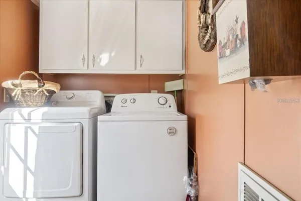 a kitchen with a refrigerator and a sink