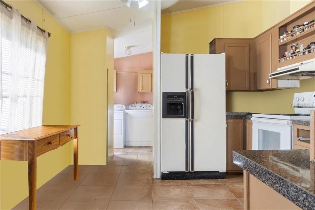 3230 Southwest 189th Avenue Dunnellon, FL 34432 - Photo 32 of 50 a kitchen with a refrigerator and a sink