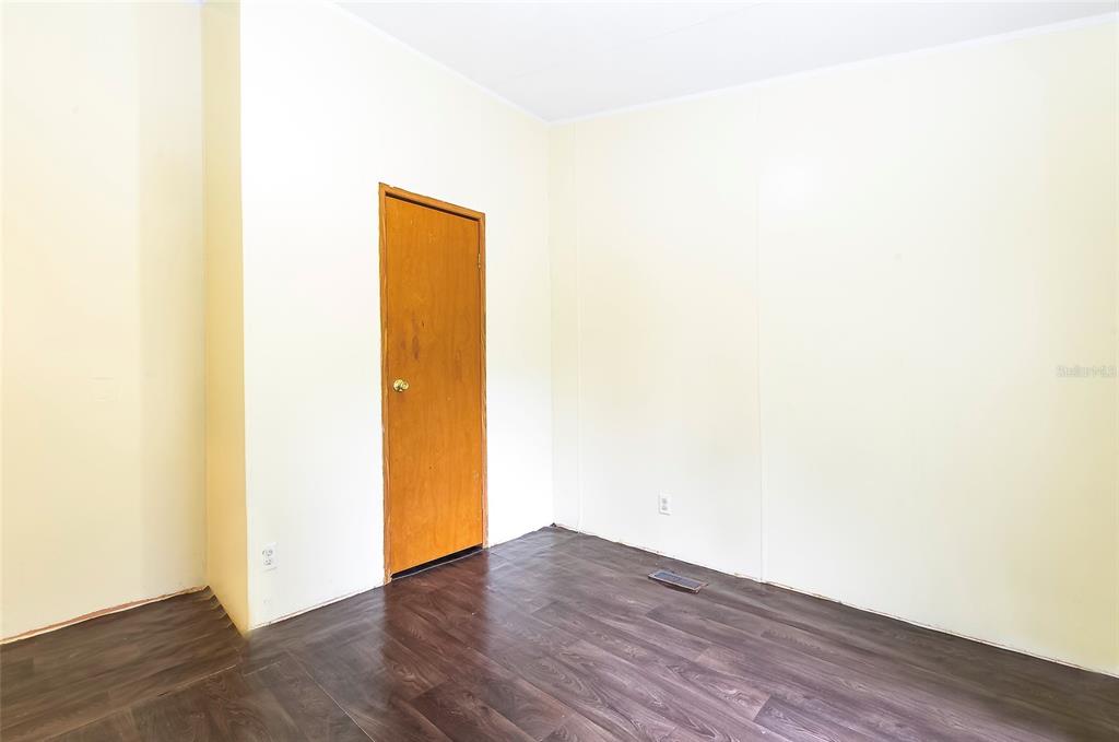 3230 Southwest 189th Avenue Dunnellon, FL 34432 - Photo 47 of 50 a view of an empty room with wooden floor