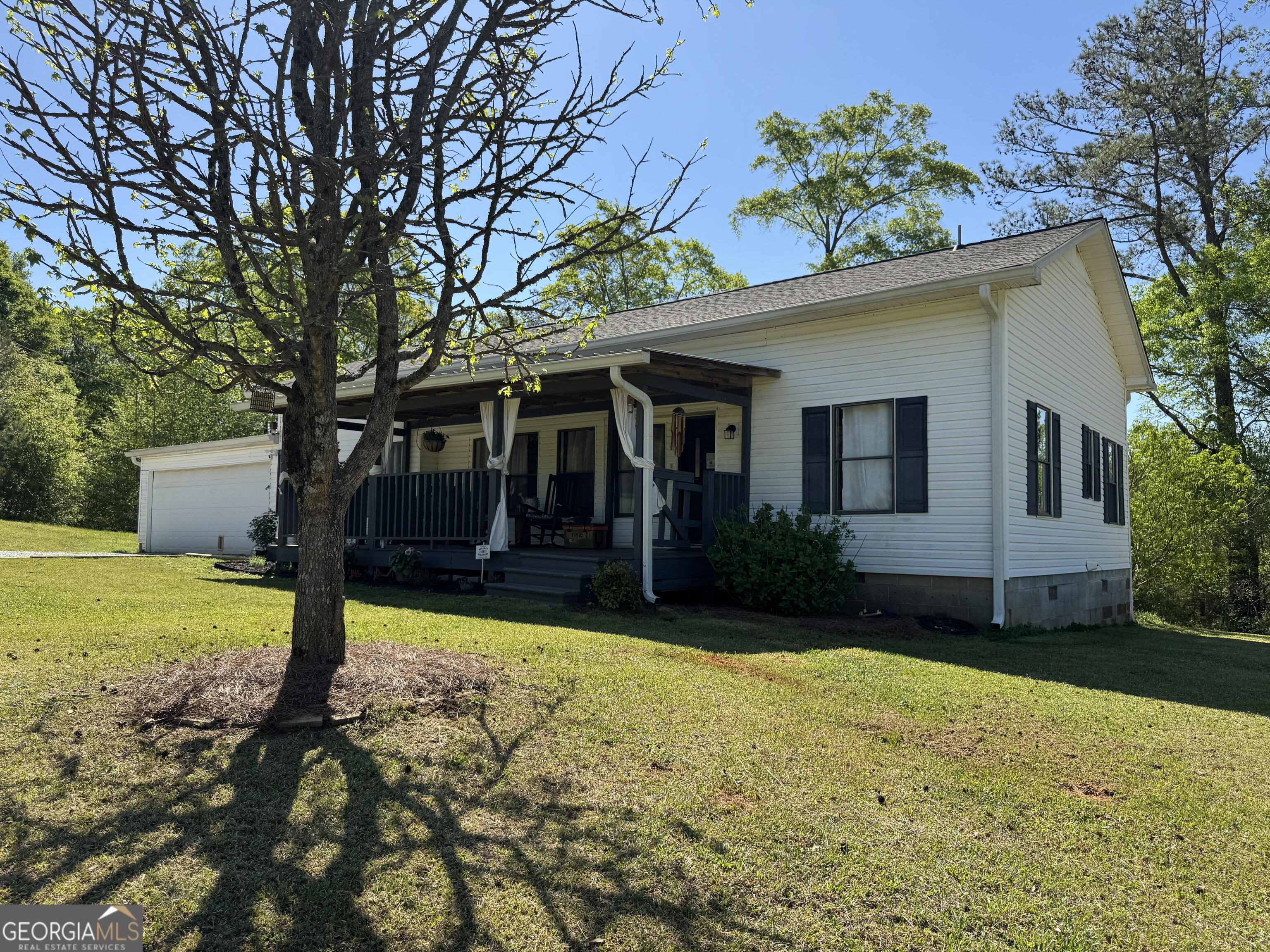530 Dot Road Bowdon, GA 30108 - Photo 1 of 1 a front view of house with yard and green space